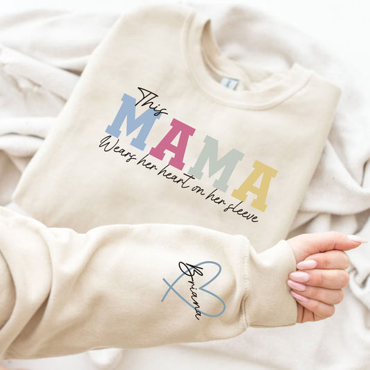 Sweat-shirt personnalisé MAMA porte son cœur sur sa manche 